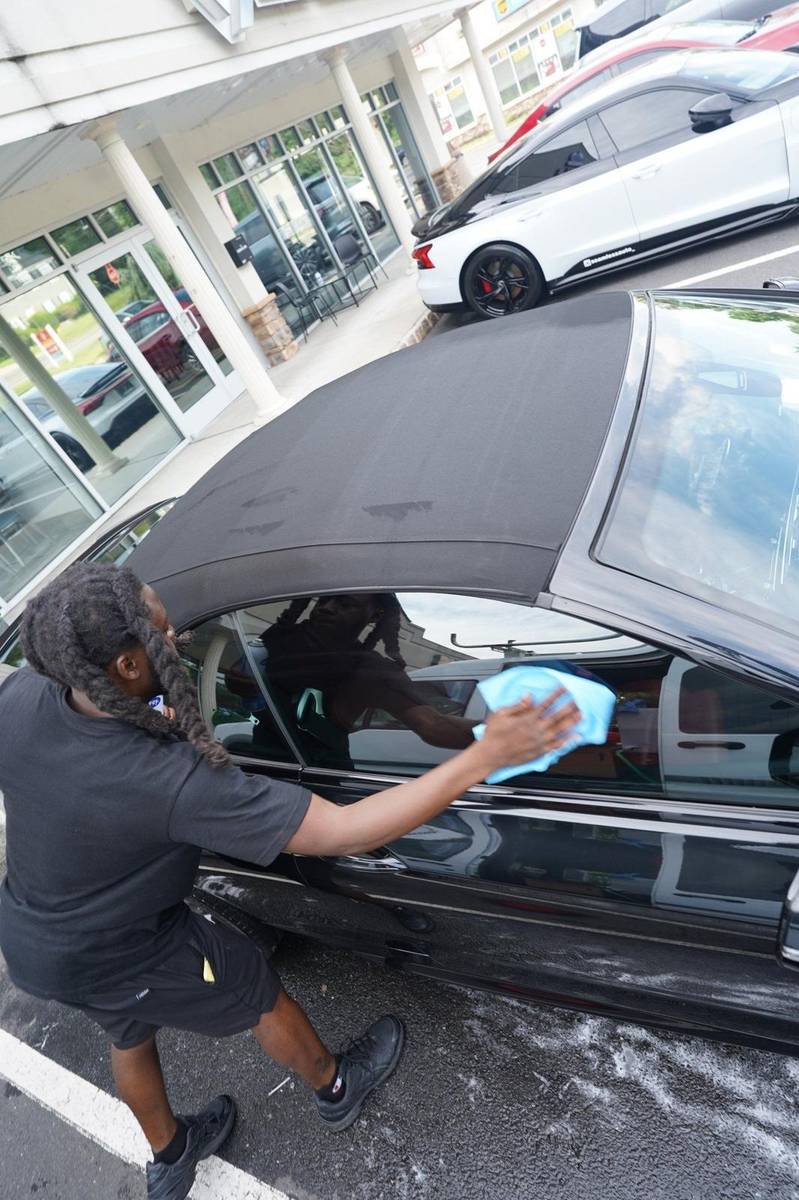 Xentra Auto technician detailing vehicle NYC